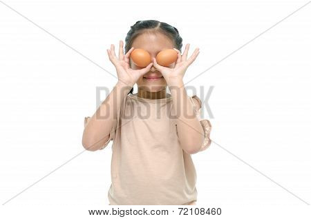 Little asian girl smiiing and holding egg