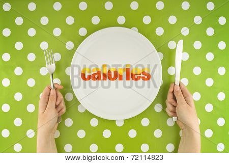 Hands At The Table With Calories On Plate