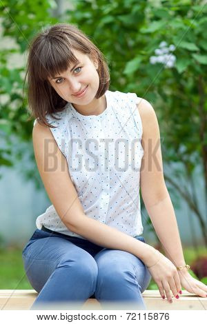 Beautiful girl on a bench