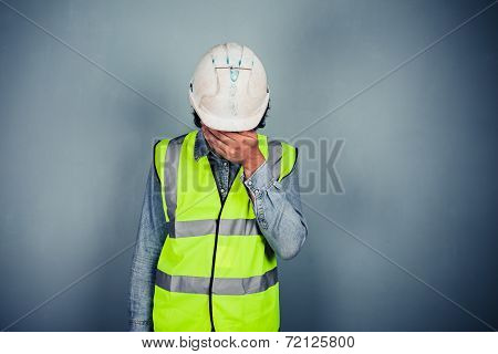 Engineer In High Vis Covering Face