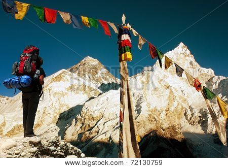 View Of Everest With Tourist And Buddhist Prayer Flags