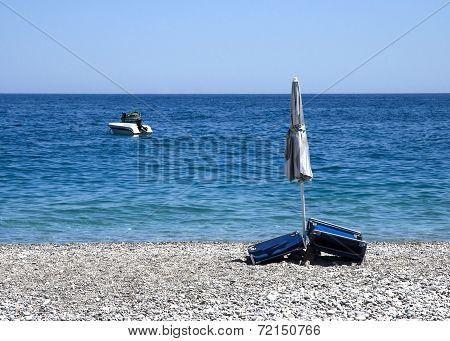still-life with beach umbrella and a boat