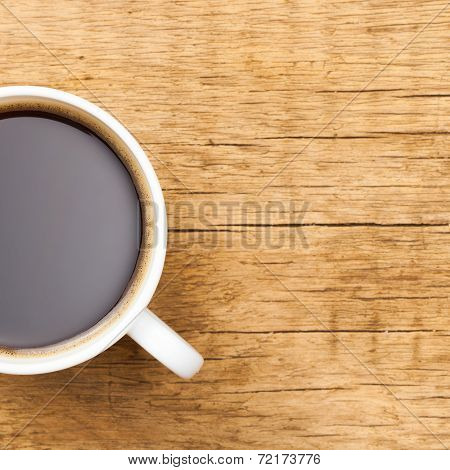 Black Coffee In White Ceramic Cup On Wooden Table - View From Top