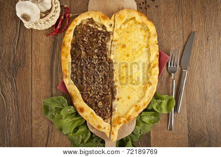 Delicious heart shaped meat and cheese Turkish pizza pide