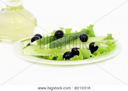 Cucumbers With Olives And Vegetable Butter Are In A Bottle