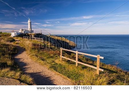 I walk along the cliff overlooking the Bay of Biscay to the lighthouse of Santander