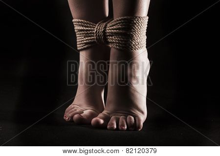 Detail Suspended Bound Feet Submissive Young Girl On A Black Background / Bdsm Theme