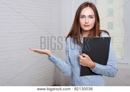 Girl Holding A Folder Expressing Bewilderment