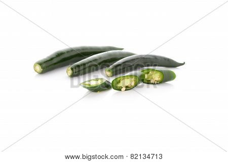 Green Hot Chili Peppers On White Background