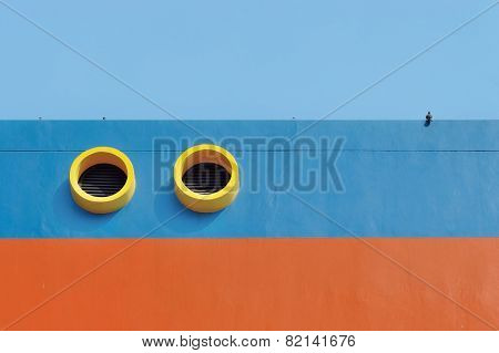 Window Feeder Pipes And Ventilation Grill Sphere Atop The Building Walls With Bright Colors . Birds
