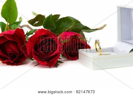 Beautiful red rose with beautiful diamond ring.