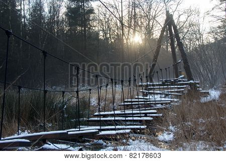 Snowy bridge in winter sun