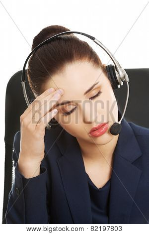 Portrait of anoyed support phone operator in headset