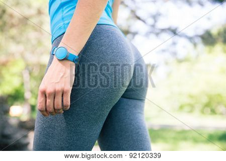 Closeup image of a fitness female body outdoors