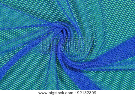 Blue Crumpled Nonwoven Fabric On A Green