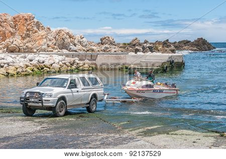 Crayfish Boat Being Pulled Onto Trailer At Kleinmond Harbor.