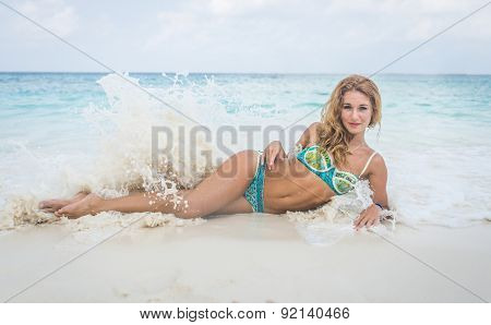 Woman Lying On White Sand Beach
