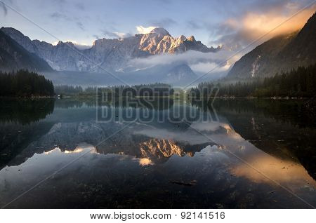 beautiful sunrise over the mountain lake in the Julian Alps