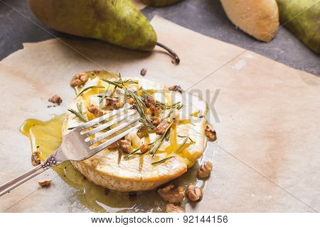 Delicious Baked Camembert With Honey, Walnuts, Herbs And Pears