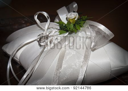 Wedding Rings On A White Pillow