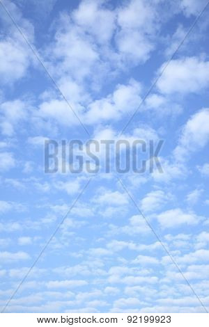 Bright sky with clouds - vertical background