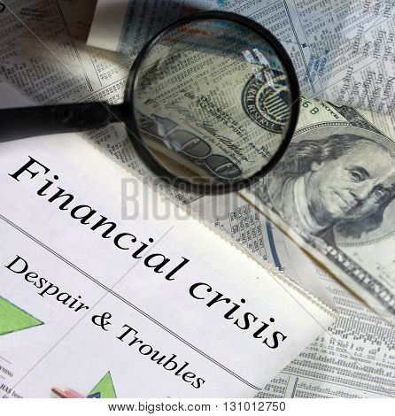 Financial crisis headlines. Magnifying glass and one hundred dollar bill in the background.