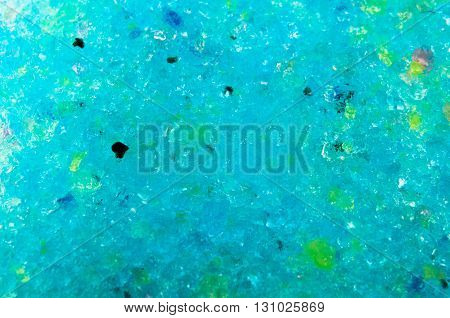 balls of multicolored hydrogel crushed to the smallest particle texture background