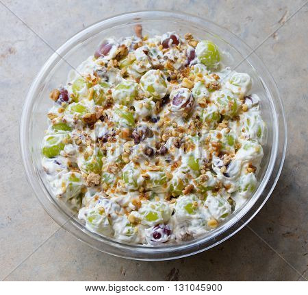 Freshly made grape salad with walnuts and brown sugar sprinkled on top