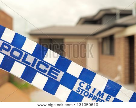 Melbourne, Australia -May 19, 2016: Blue and white Police tape cordoning off a building site like a crime scene
