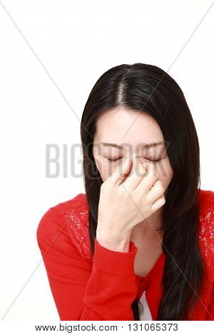 portrait of woman suffers from Asthenopia on white background