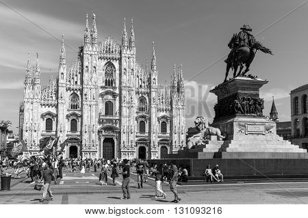 Milan Italy - July 5 2014: People in Duomo square under the Vittorio Emanuele II monument
