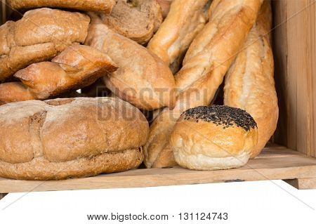 Bread in wooden box isolated on white background with clipping path