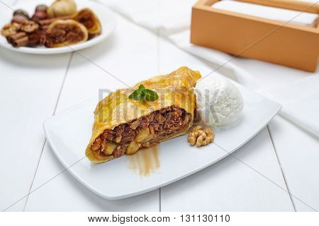 Traditional strudel with figs and nuts sweet healthy dessert on white plate