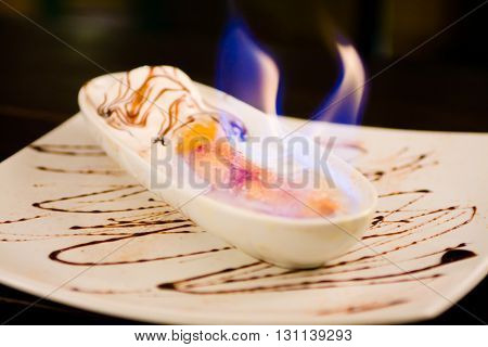 Gourmet Flame Banana Split on black background