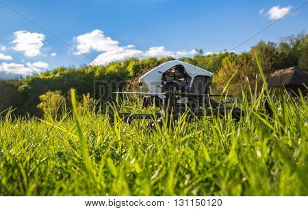 Dron Is Located In The Green Grass Before Takeoff