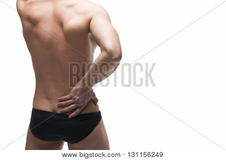 Kidney pain. Man with backache. Pain in the human body. Muscular male body. Isolated on white background. Middle part of the body