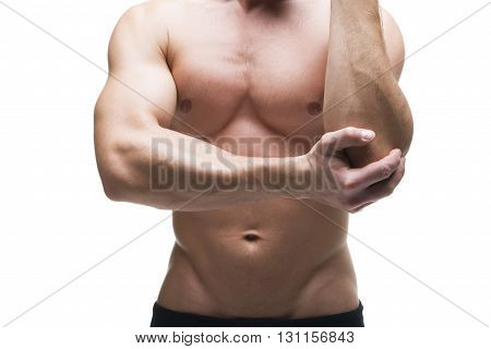 Pain in the elbow. Muscular male body. Isolated on white background. Middle part of the body