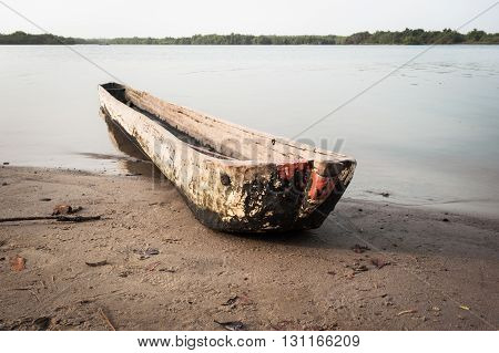 Traditional dugout wooden canoe on the Mono's river shore Benin Africa 2015