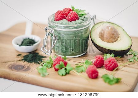Green Mousse Of Raspberries. Jar Mousse With Raspberries At The Top Standing On The Board. Half An A