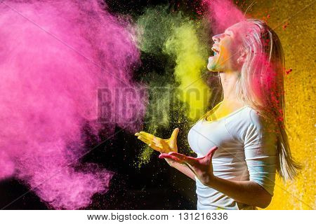 Portrait of a beautiful female with holi paint
