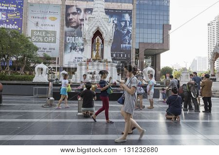 BANGKOK THAILAND - APR 17 : scene of tourist walking in Trimurati shrine at Central world in Ratchaprasong area on april 17 2016. Thailand. Trimurati shrine is one of sacred item in Ratchaprasong area