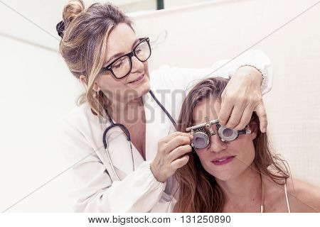 Specialist In Ophthalmology Test New Lenses On A Patient With Phoropter