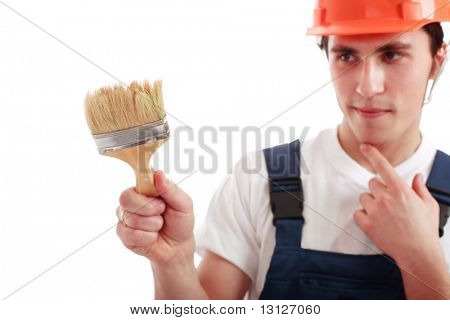 Muscolare uomo giovane in un generatore uniforme con strumenti.