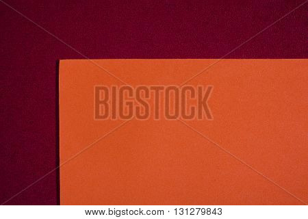 Eva foam ethylene vinyl acetate smooth orange surface on red sponge plush background