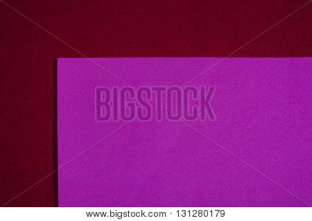 Eva foam ethylene vinyl acetate smooth pink surface on red sponge plush background