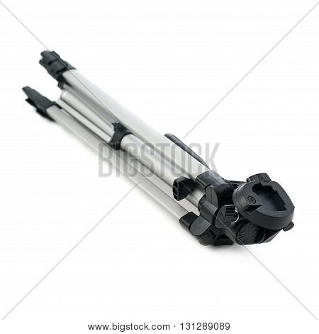 Camera gray tripod over isolated white background