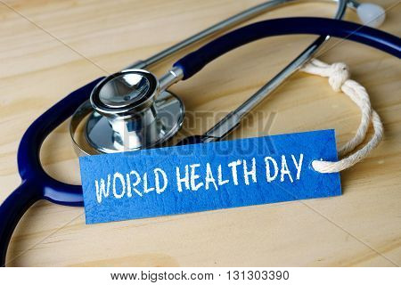 Medical Conceptual Image With World Heatlh Day Words And Stethoscope On Wooden Background.