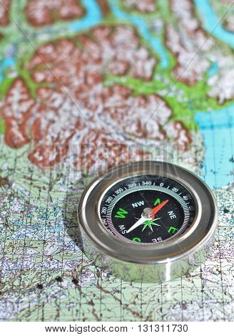 The compass on the map. Magnetic compass is located on a topographic map.