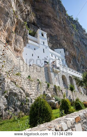 OSTROG MONTENEGRO - SEPTEMBER 22 2015 : Pilgrims and other visitors in the Ostrog Monastery a Serbian Orthodox Monastery in Ostrog Montenegro