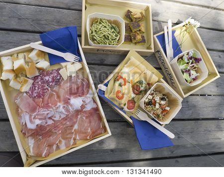 Italian lunch with serano ham and salami on table
